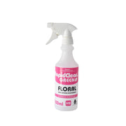 White spray bottle with pink label on a white background